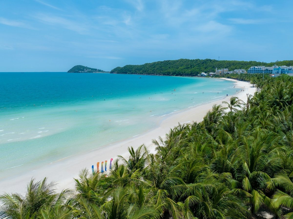 Phuket coastline with a white sand beach and palm trees